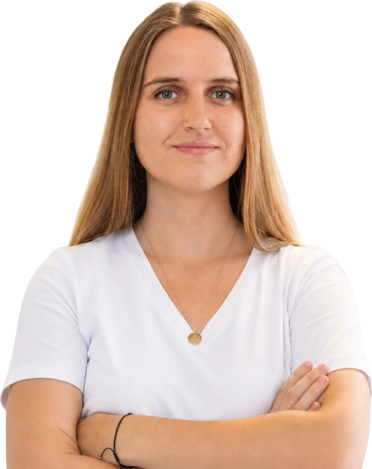Natalia, website designer and developer, standing with arms crossed